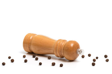 Wooden pepper mill isolated on white background.