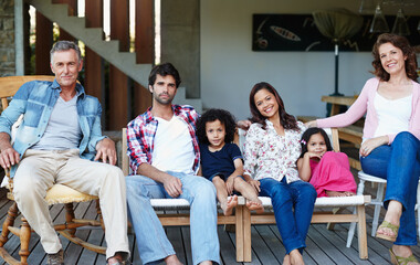 Portrait, smile and big family in home for relax, support or interracial people bonding together...