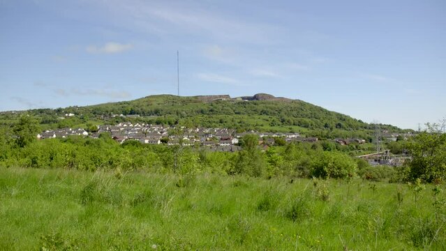 Right to left camera move in 25fps slow motion of the Black Mountain in West Belfast, Northern Ireland on a sunny day.

Produced in 4K with Rec709 color and filmed from Colin Glen Forest Park.