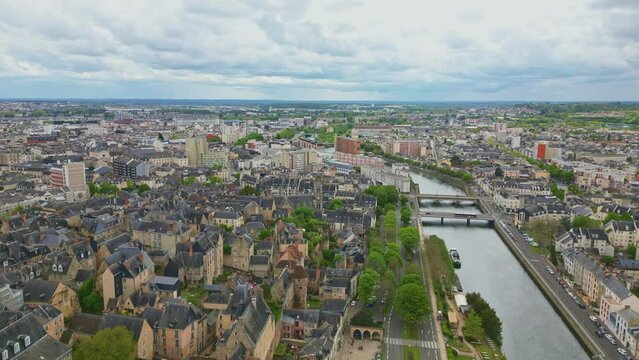 Sarthe River crossing Le Mans city, France. Aerial forward and sky for copy space