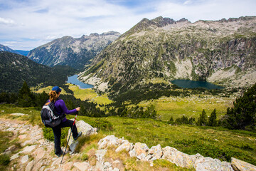 Young hiker woman in Vall de Boi, Aiguestortes and Sant Maurici National Park, Spain