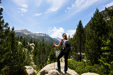 Young hiker woman in Vall de Boi, Aiguestortes and Sant Maurici National Park, Spain