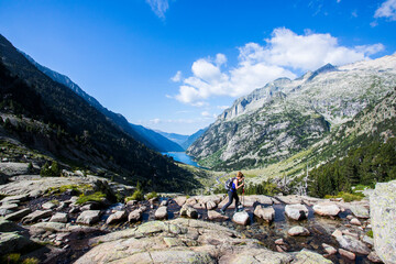 Young hiker woman in Vall de Boi, Aiguestortes and Sant Maurici National Park, Spain