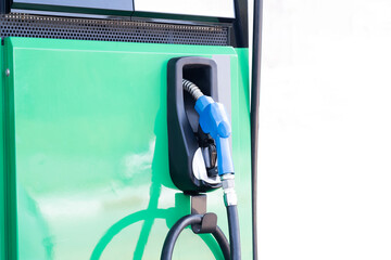 Close-up of the blue fuel filler handle. Fuel pump in a gas station fuel dispenser