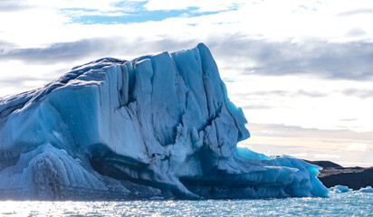 A large ice block with a face carved into it