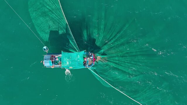 Drone view a fishing boat is netting fishes on  Tuy Hoa sea, Phu Yen province, central Vietnam