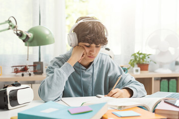 Student listening to music and doing homework