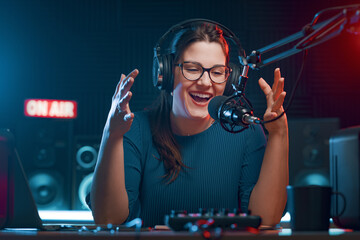 Cheerful radio DJ hosting a radio show
