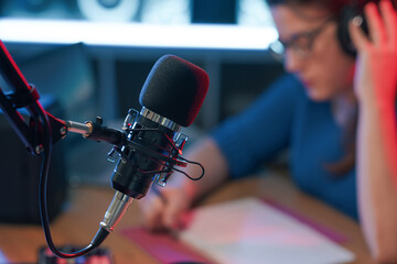 Radio presenter working and professional microphone