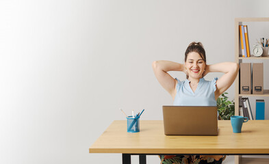 Happy woman relaxing in the office