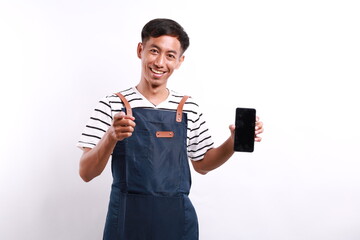 Young asian man barista bartender barman employee in blue apron white t-shirt work in coffee shop...