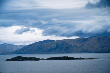 Island in the center of a tranquil lake in Scotland.