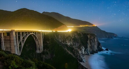 California's iconic Bixby bridge lit up by a timelapse of headlights of vehicles
