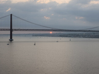 25th April Bridge over the Tejo River at sunset in Lisbon, Portugal