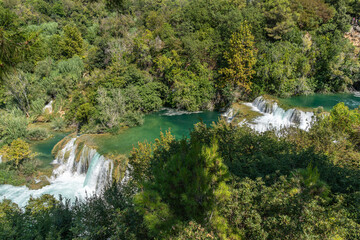 Krka River Flowing Through Majestic Green Forest in Krka National Park, Croatia
