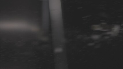 Closeup footage of the falling baling flour, with blur dark background