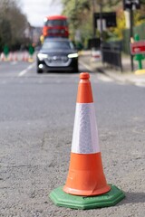 Orange Traffic Cone on London Street with Blurry background