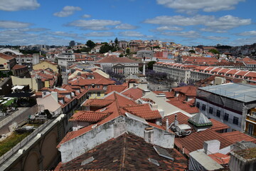 Aerial view of buildings and landmarks in Lisbon Portugal with incredible architecture and a blue sky background. 