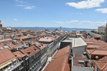 Aerial view of buildings and landmarks in Lisbon Portugal with incredible architecture and a blue sky background. 