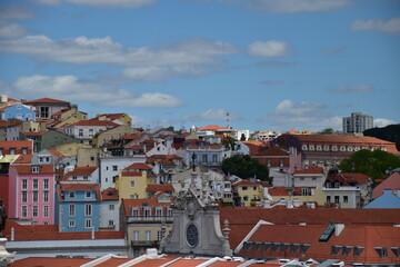 Aerial view of buildings and landmarks in Lisbon Portugal with incredible architecture and a blue sky background. 