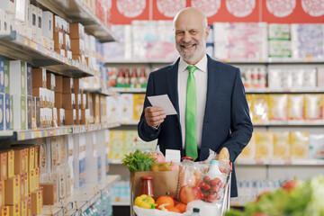 Confident businessman at the grocery store