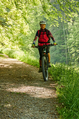 Person cycling in the Toss Valley region near Zurich, Switzerland
