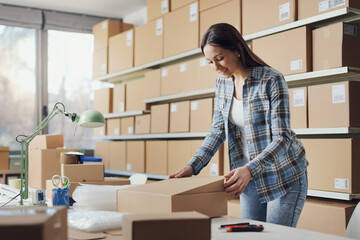 Woman closing a delivery box