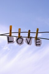 clothes drying on rope with letter love