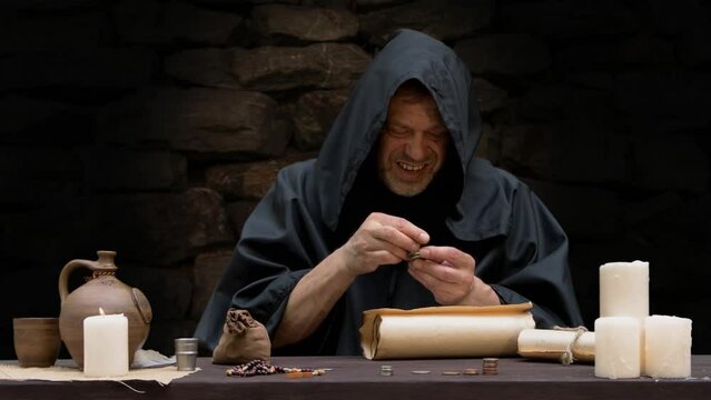 Monk counting money in stacks sitting at table 1