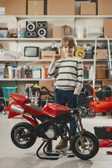 Portrait of a boy and his motorbike