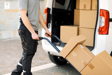 Delivery guy pushing a hand truck