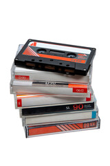 Close-up of many audio tapes. Analog storage medium. Cassettes for audio recordings and music. Isolate on a white back