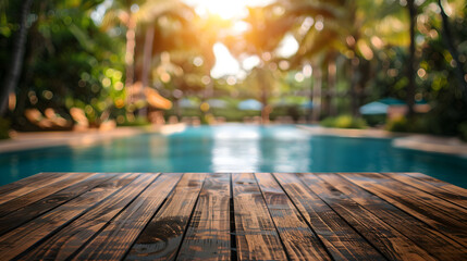 Fototapeta premium Empty wooden table in front of blurred pool resort