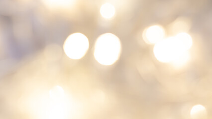 Golden bokeh background with soft, shimmering lights creating a warm ambiance.