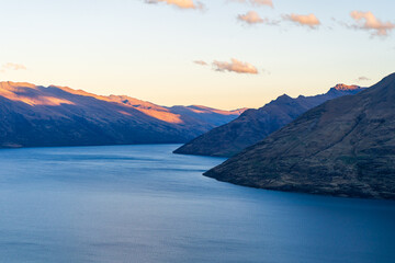 Lake Wakatipu and mountain range near Queenstown, New Zealand, Sunset.