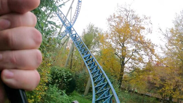 Experience the thrilling steel roller coaster ride with stunning autumn foliage views and high G-force excitement.