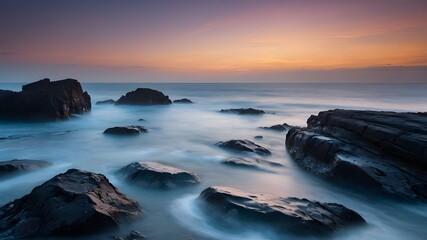 Fototapeta premium Golden Sands: Capturing the Tranquility of a Beach at Sunset - A Serene Evening on the Sandy Shore: Golden Hour Delights - Sunset Serenity: Photographing the Beauty of a Beach Bathed in Golden Light