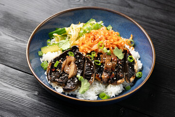 Korean mushrooms bowl with cucumber salad, kimchi and rice