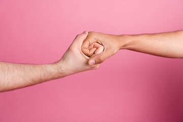 Photo of two people hold together hands fist bum teamwork isolated pastel color background