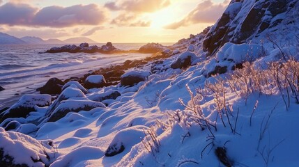 A snowy beach with a rocky shoreline. The sun is setting in the distance. The sky is a mix of blue and orange. The snow is covering the ground and the rocks. The scene is peaceful and serene - Powered by Adobe