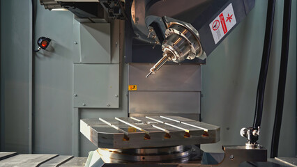 Rotating automated Machine with metal plate and drill. Media. Automated machine with drill and...