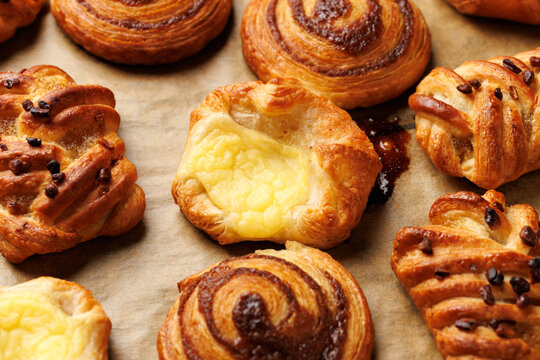 Mini danish pastry selection. Maple pecan plaits, cinnamon swirls and vanilla creme crowns