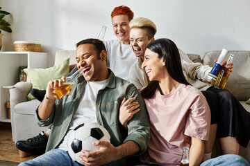 A diverse group of people sitting atop a couch, enjoying each others company at home.