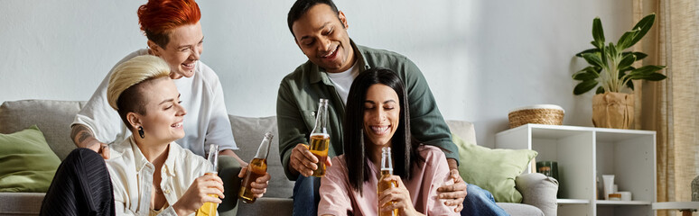 A diverse group of friends relaxes on a couch, enjoying beer.