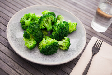 Boiled broccoli inflorescences in plate