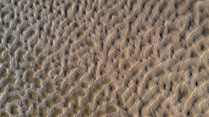image texture at low tide on the beach from a drone