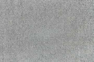 Close-up view of sandpaper texture in sunlight capturing its abrasive surface.