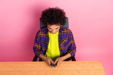 Photo of guy sit desk using cell smart gadget texting typing isolated pastel color background