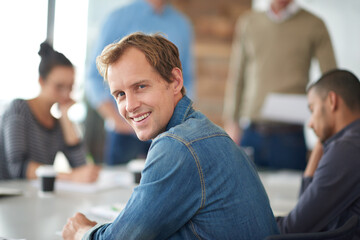 Office, meeting and portrait of businessman by desk for creative company, collaboration and...