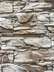 Fototapeta premium pattern of decorative stone wall surface natural color